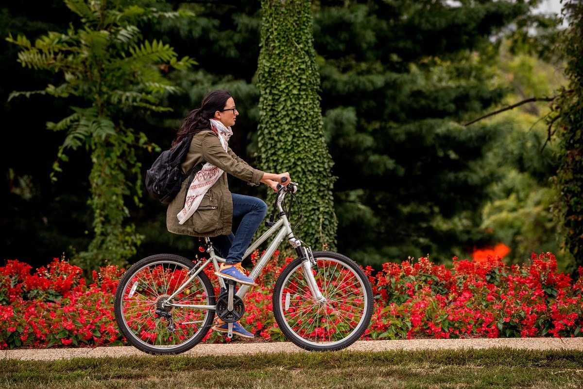 biking in front of flowers