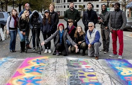 PAL Ambassadors pose near a painted crosswalk