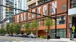 a photo of an office building in Ballston with large white lettering painted across it that reads: Ballston