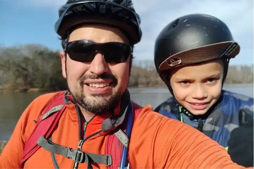 a photo of a father and son bike riding together taking a selfie