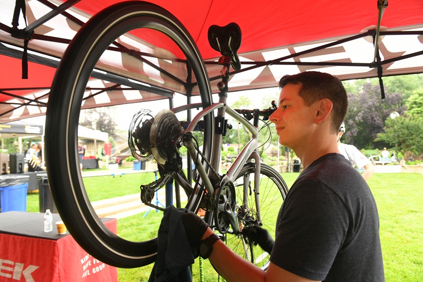A bike mechanic working on a bike